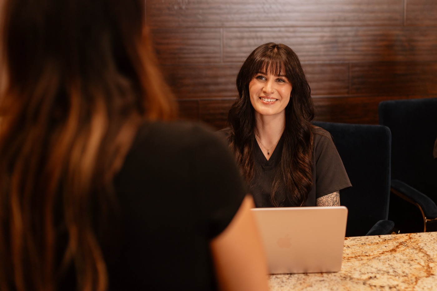 The Onyx front desk team welcoming a patient